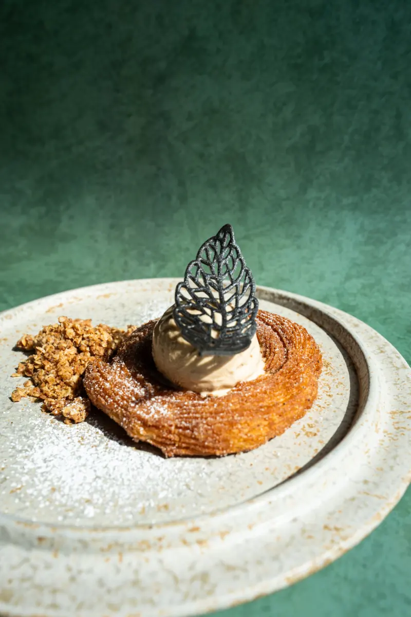 A dessert with a lace tuile