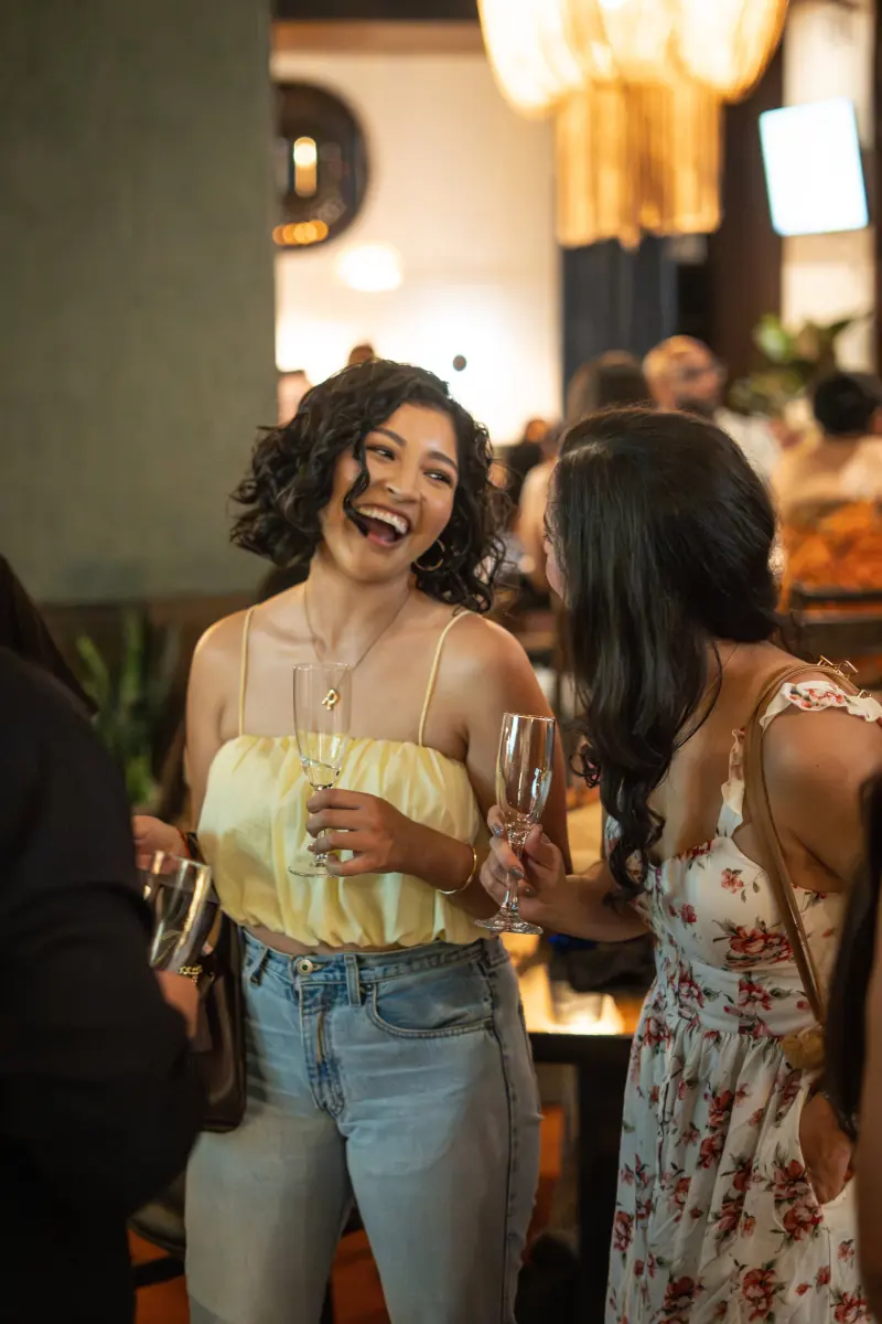 A guest laughing at the table